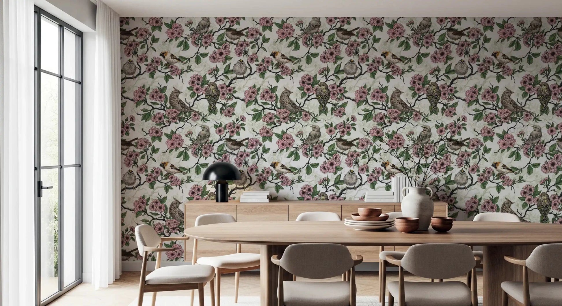 Kitchen and dining room with white wallpaper and pink blossom birds