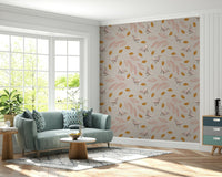 A repeating birds and foliage wallpaper with soft pink branches and small decorative leaves.