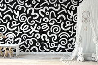 Black white abstract doodle wallpaper in contemporary living room