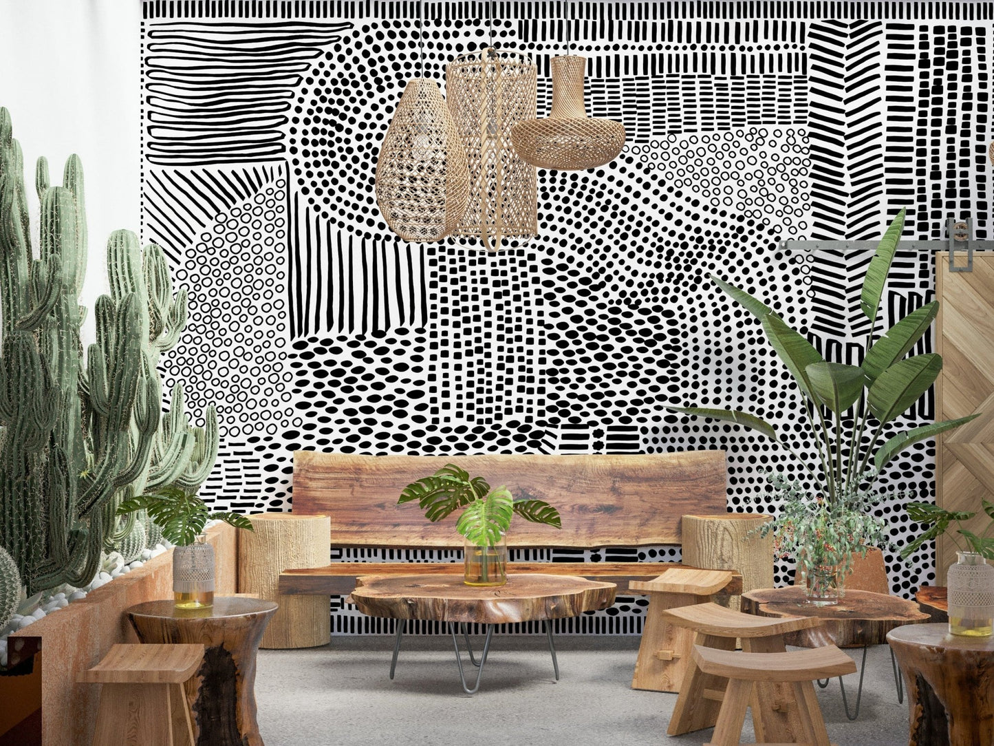 Black And White Maze wallpaper mural above a live-edge wood bench with cacti in a boho lounge