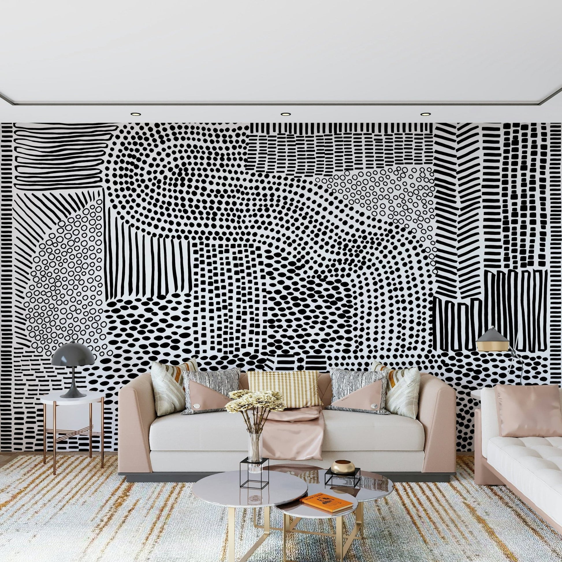 Black And White Maze wallpaper mural behind a blush pink sofa with gold accents in a living room