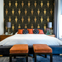 Geometric patterns in black and gold for a glamorous feature wall

