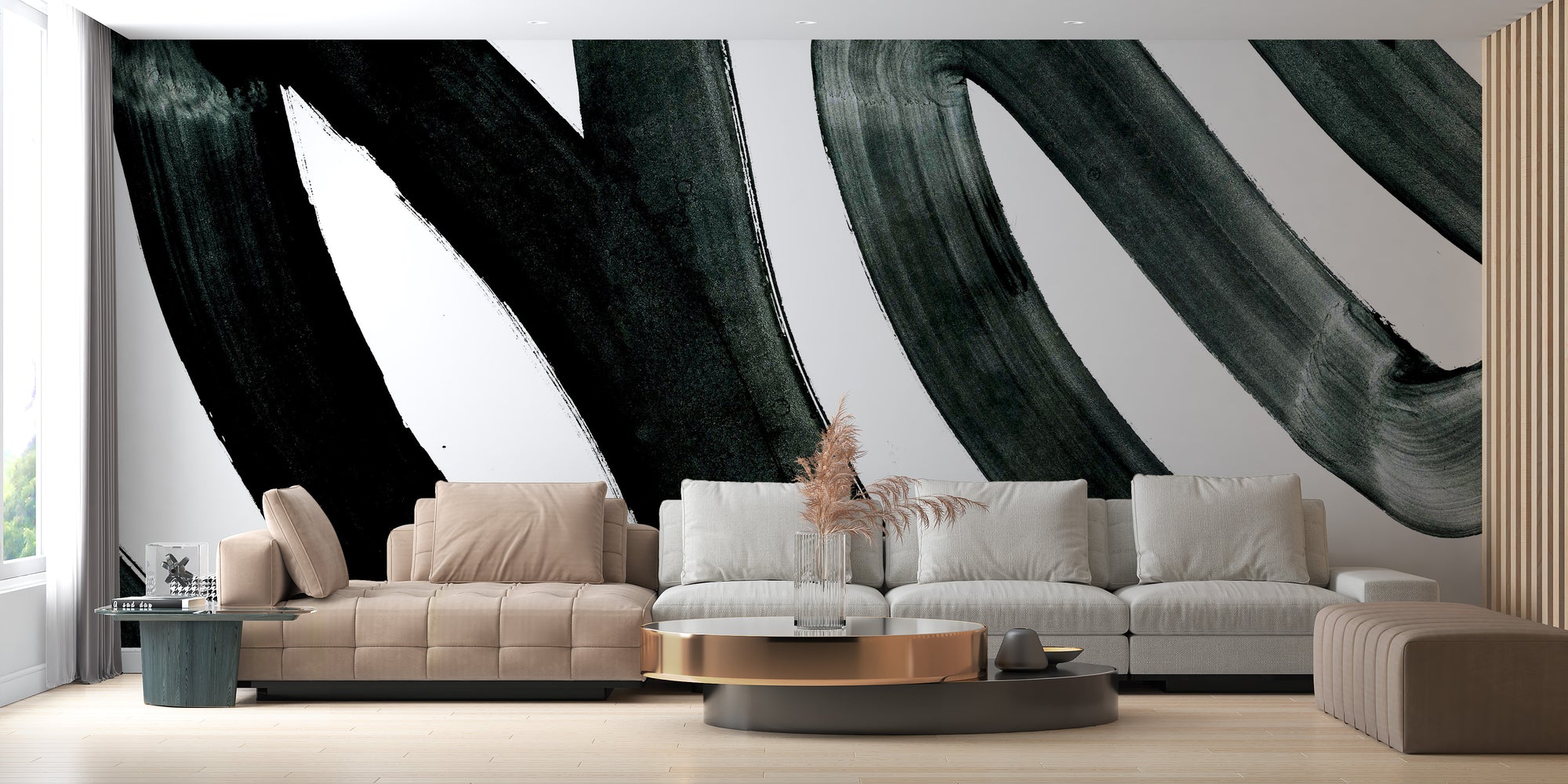 Black Brush Stroke wallpaper mural with bold black painterly swirls on white behind a beige and grey sofa in a living room