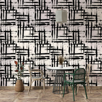 An angled shot of a wall with a painted wallpaper

