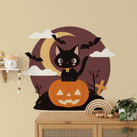 Removable pumpkin wall decor with a charming black cat illustration.
