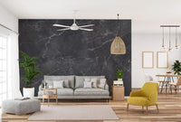 Black Gray Marble wallpaper mural behind a gray sofa and yellow armchair in a bright living room
