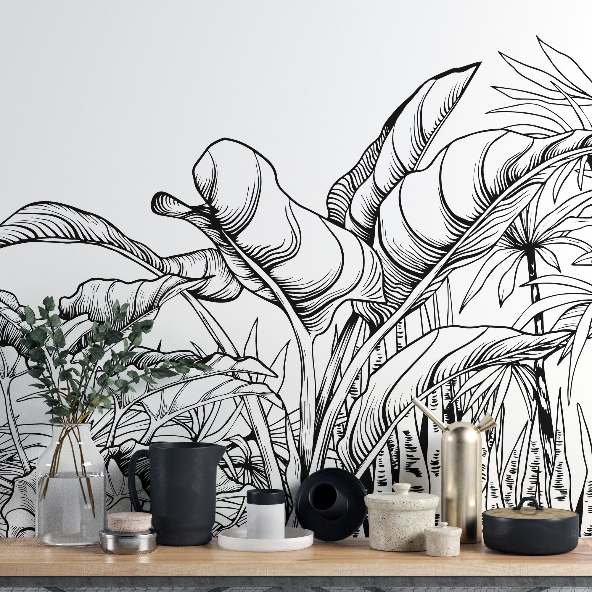 Black & White Big Tropical Leaves wallpaper mural shown as a full feature wall that highlights the design
