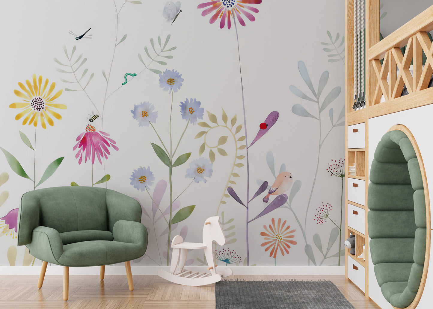 Bloom and Bird wallpaper mural of watercolor flowers and a pink bird beside a green armchair and rocking horse in a kids room