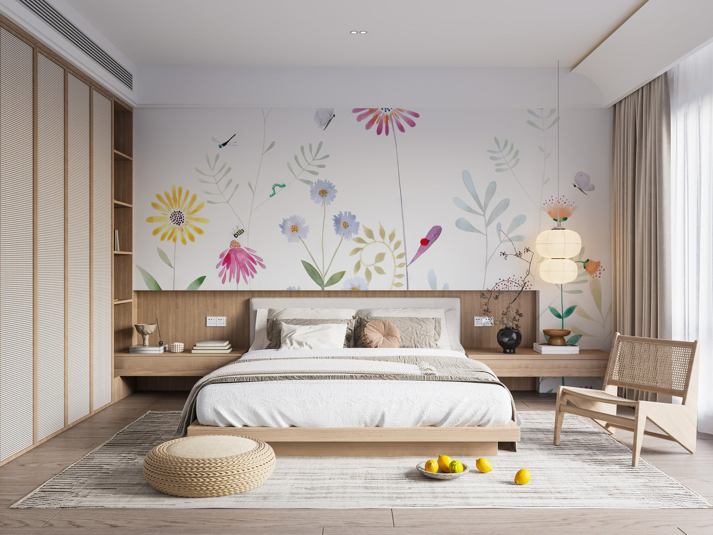 Bloom and Bird wallpaper mural of watercolor flowers above a low wood platform bed and rattan chair in a bedroom