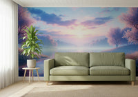 Bloom by the Lake wallpaper mural of a soft pastel lake and blossom trees behind a sage green sofa in a living room