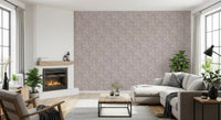 Bloomscape Beige wallpaper in dusty-pink florals beside a fireplace behind a cream sectional in a living room