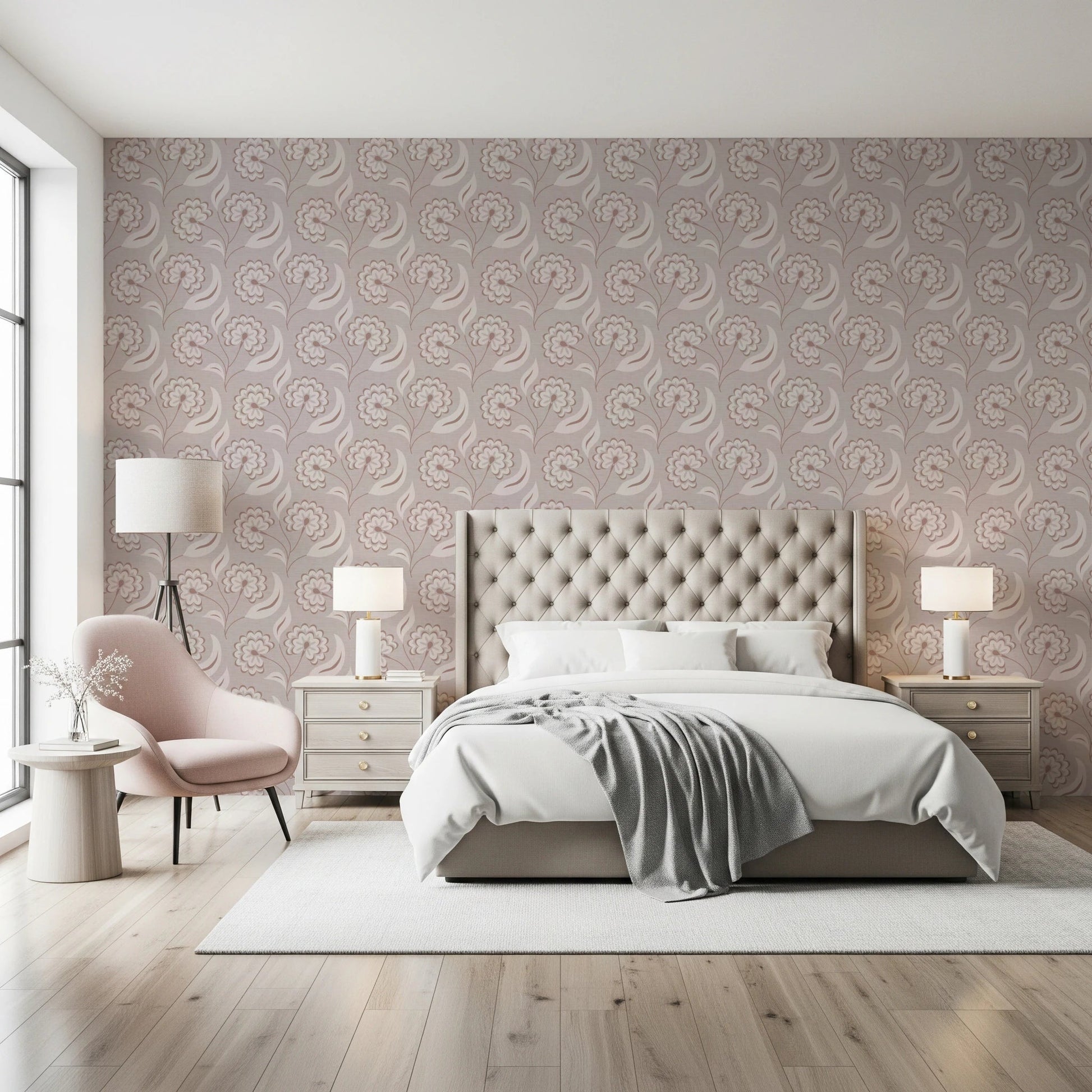 Bloomscape Beige wallpaper in dusty-pink blooms behind a tufted cream headboard with a pink accent chair in a bedroom