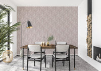 Bloomscape Beige wallpaper in soft mauve behind a wood dining table and black chairs near stacked firewood
