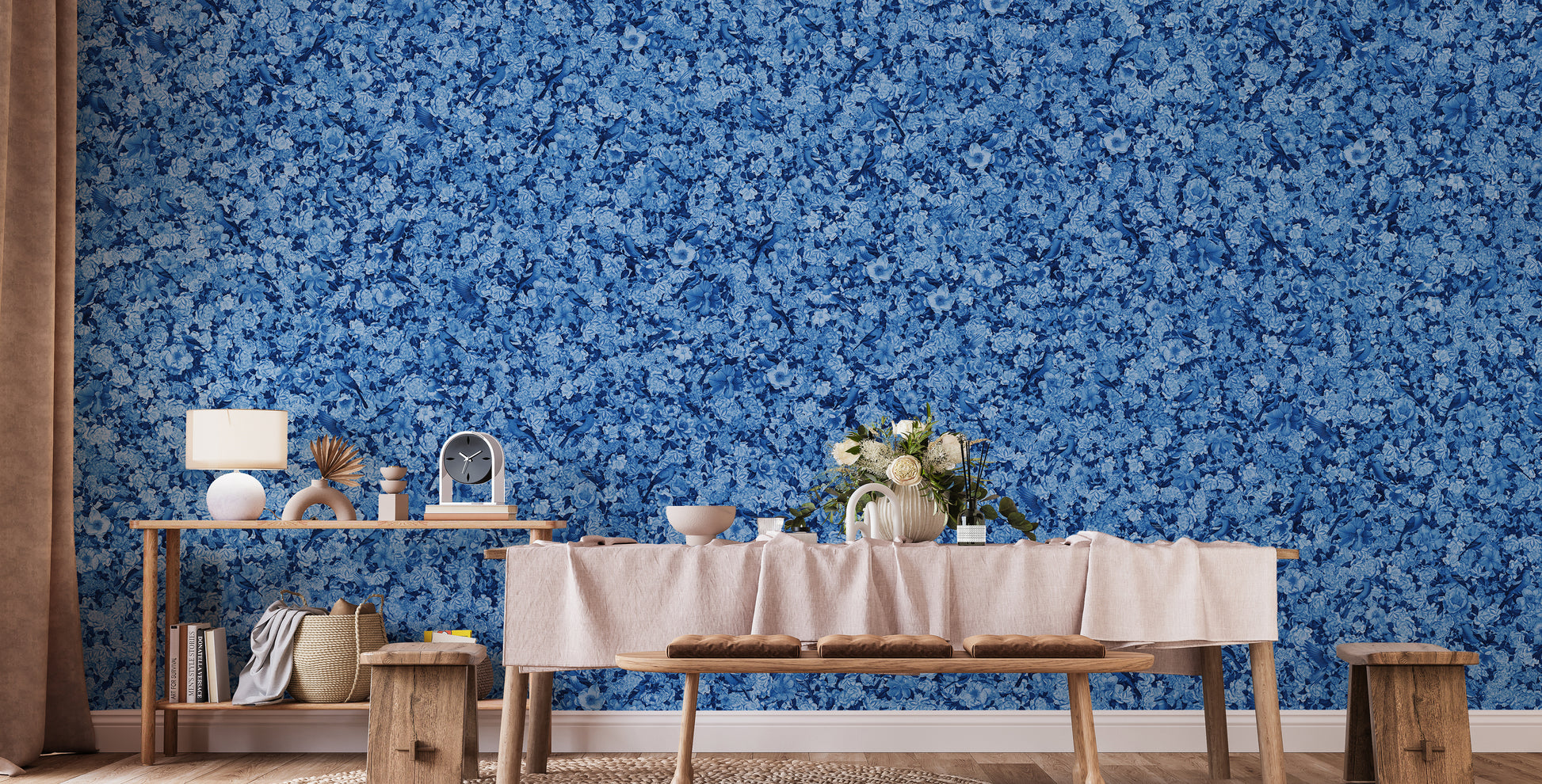 Blue Bird Flower wallpaper mural in blue florals behind a wooden bench and console table with a lamp