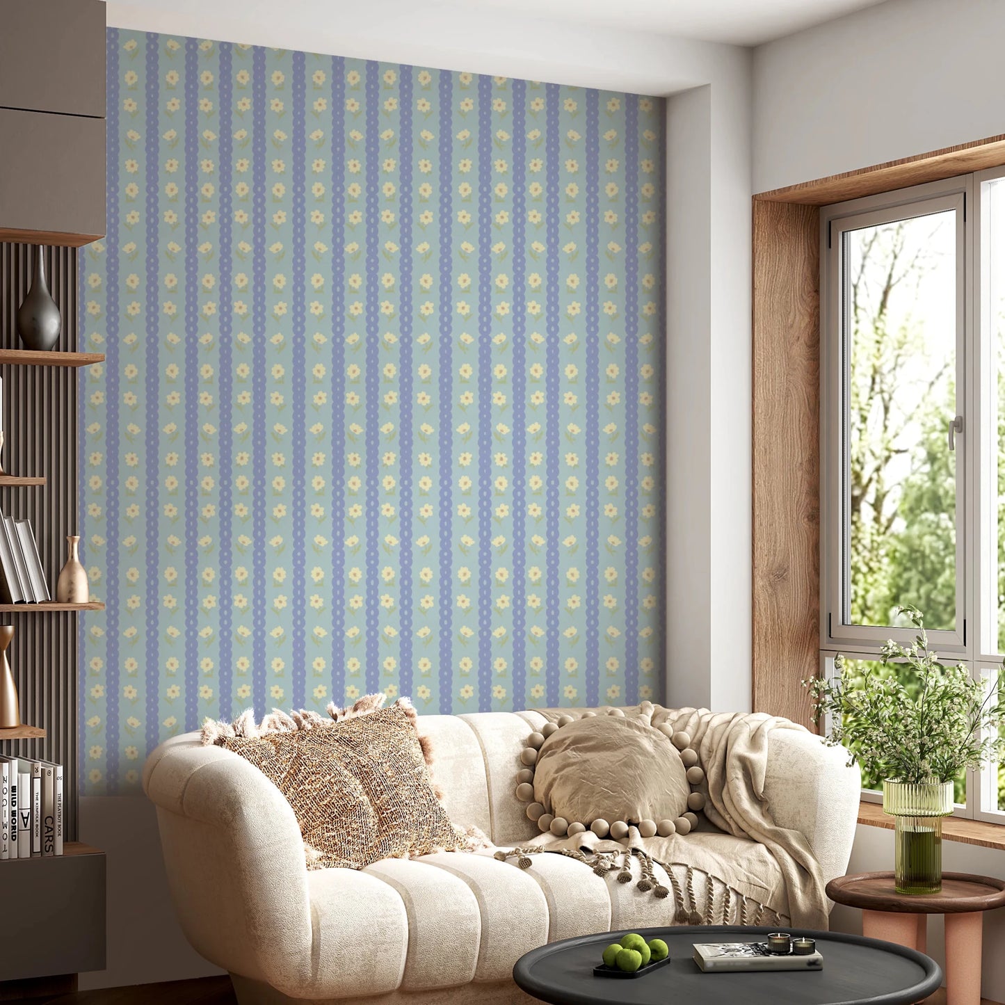 Blue Bloom Stripes wallpaper mural in a living room behind a cream scalloped sofa with pompom cushions, blue stripes