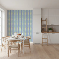Blue Bloom Stripes wallpaper mural in a dining room behind a white marble table and wood chairs, blue stripes