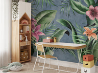 Blue background mural with large green floral leaves design.
