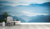 Soft watercolor mountain wallpaper in shades of blue.