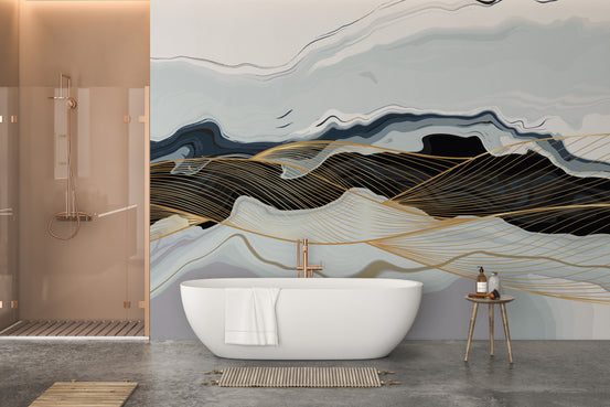 Blue & Gold Wavy Marble wallpaper mural with navy waves and gold lines behind a white freestanding tub in a bathroom