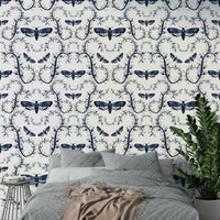 Deep-toned wall mural with vines and moths

