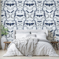 Moody blue wallpaper with gothic insect details

