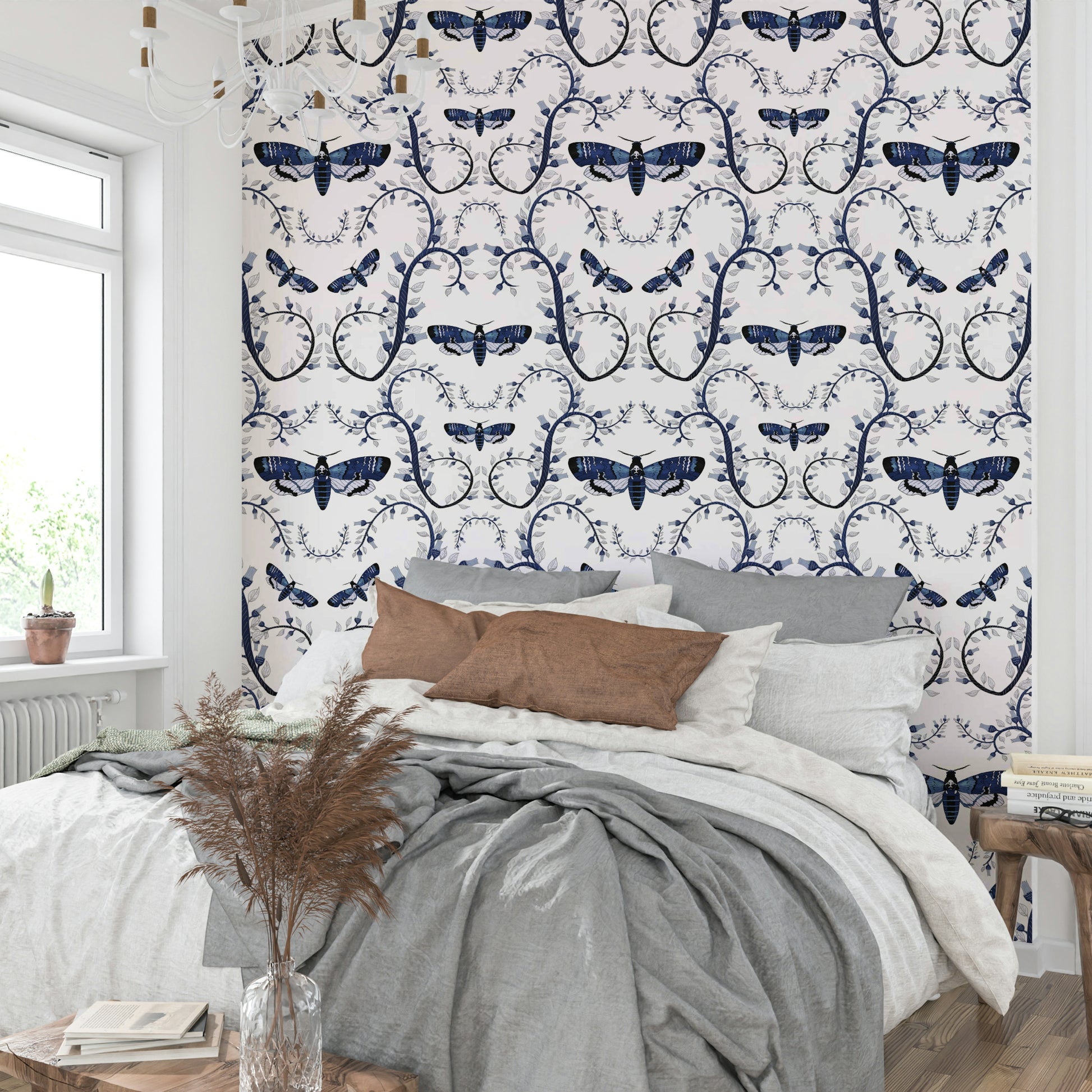 Mural wallpaper of moths and botanical swirls

