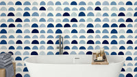 A modern wall mural with a repeating pattern of half-moon shapes.

