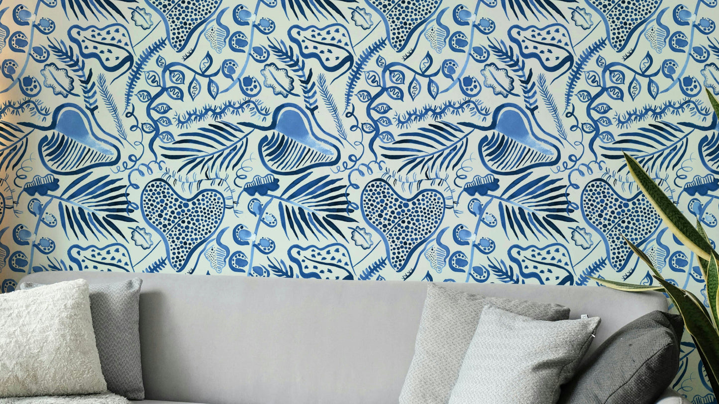 Deep jungle leaves wallpaper in shades of blue

