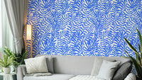 Blue Matisse Leaves Wallpaper on a living room wall

