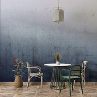 The wallpaper shows a gradient from blue to gray.

