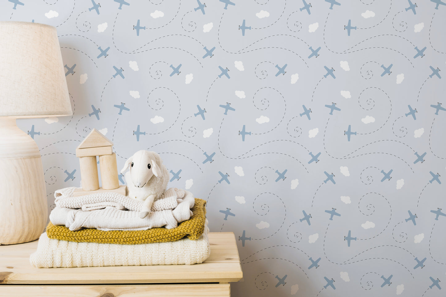 Blue plane pattern wallpaper with white clouds
