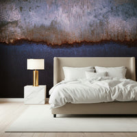 Abstract mural with weathered metallic surfaces resembling a serene horizon