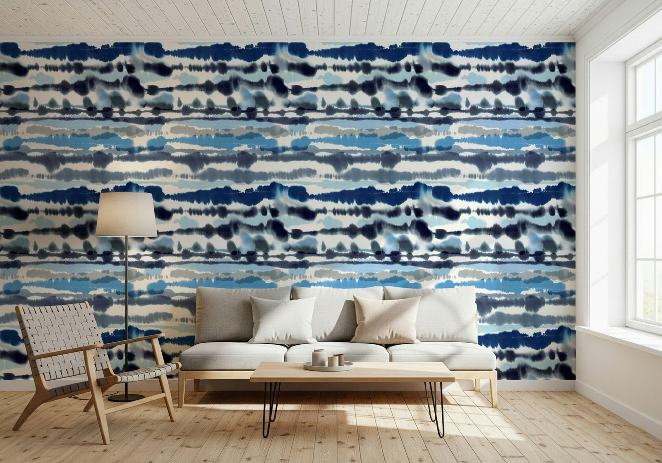 Blue Tide Wallpaper in a modern living room with a white sofa and coastal accents.