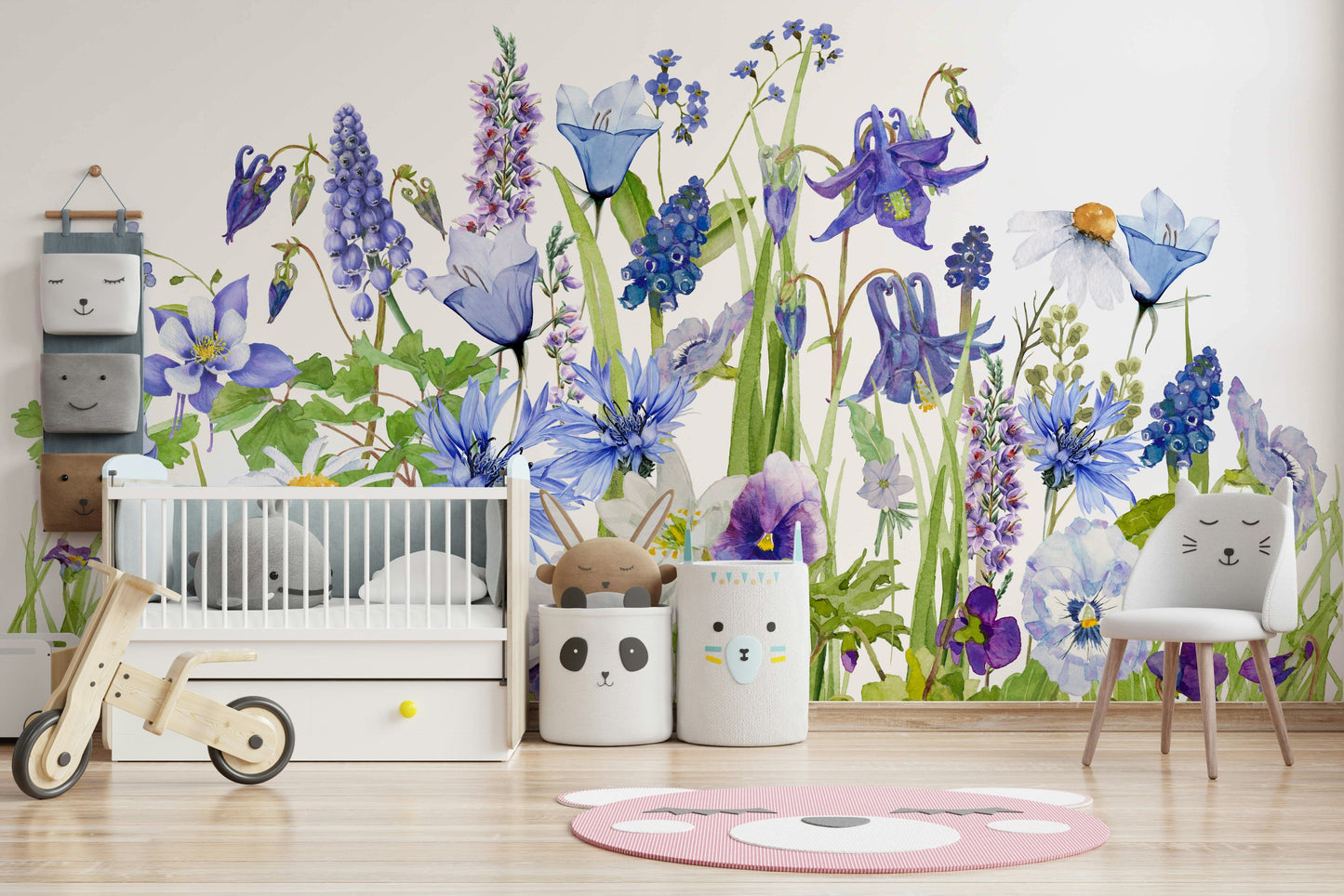 Wall mural with a blue watercolor wildflower meadow.

