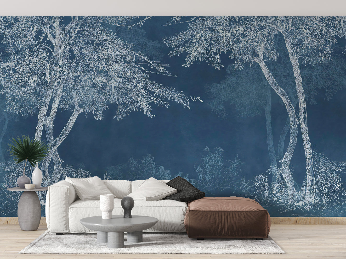 Blue Woods wallpaper mural styled as a feature wall behind a dining table and chairs in blue tones