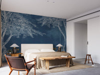 Blue Woods wallpaper mural as a bedroom feature wall behind the headboard in blue tones