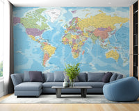 Blue World Map wallpaper mural as a feature wall in a home office workspace in a multicolour palette