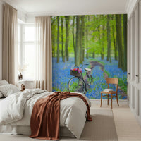 Bright green trees blue blossoms wall mural bike.