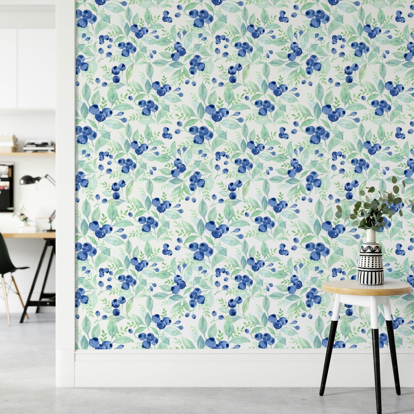The scene includes blue blueberries and green leaves.

