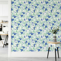 The scene includes blue blueberries and green leaves.

