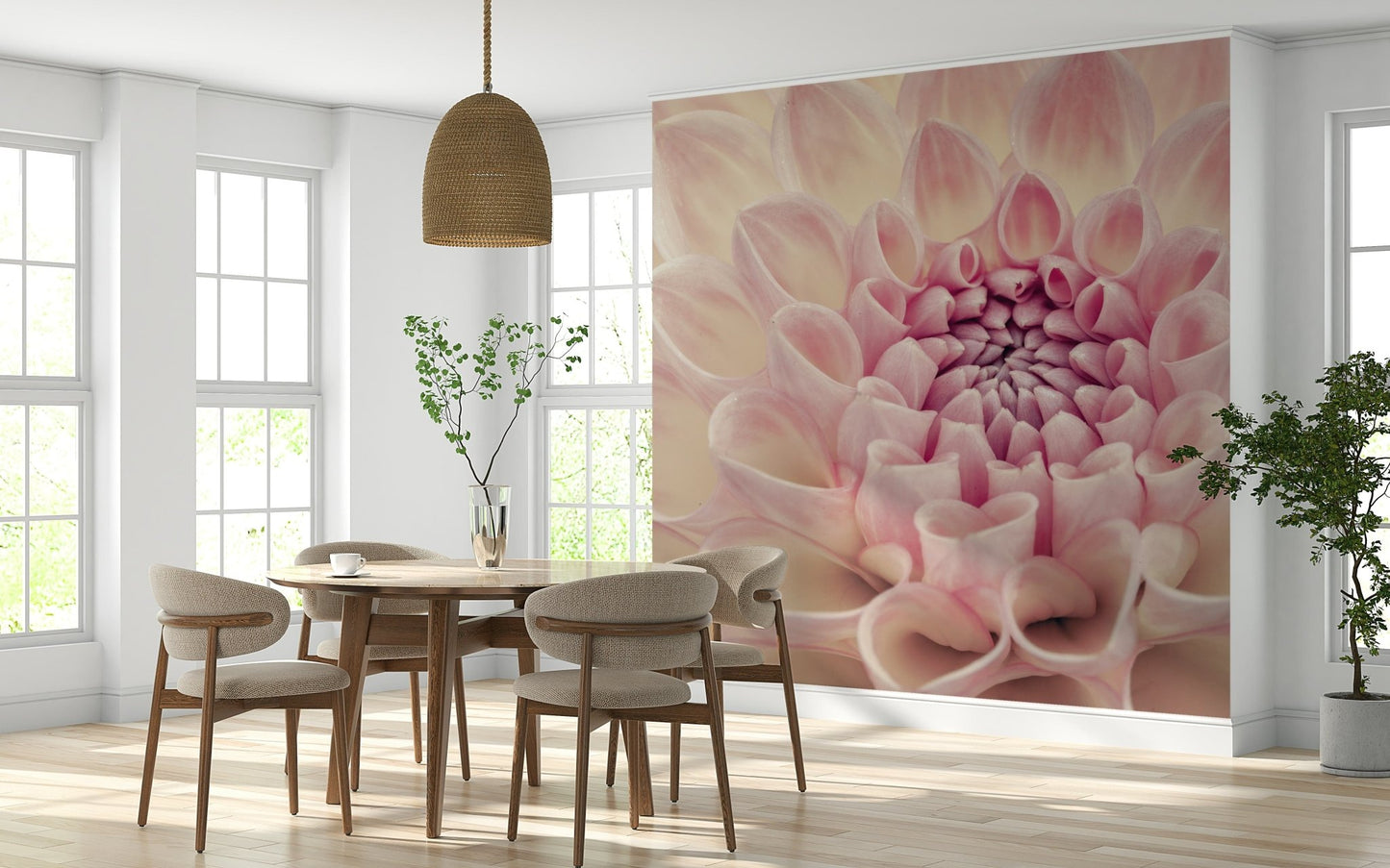 Blush Bloom wallpaper mural of a pink dahlia flower behind a round wood table and beige chairs in a dining room