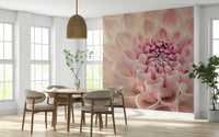 Blush Bloom wallpaper mural of a pink dahlia flower behind a round wood table and beige chairs in a dining room