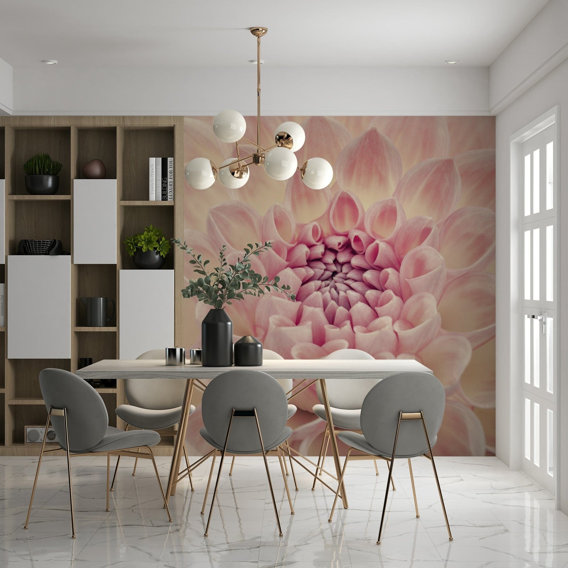 Blush Bloom wallpaper mural of a pink dahlia behind a dining table with grey chairs and gold globe chandelier