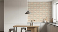 Dining room with blush fronds and striped wallpaper in warm beige and taupe color tones