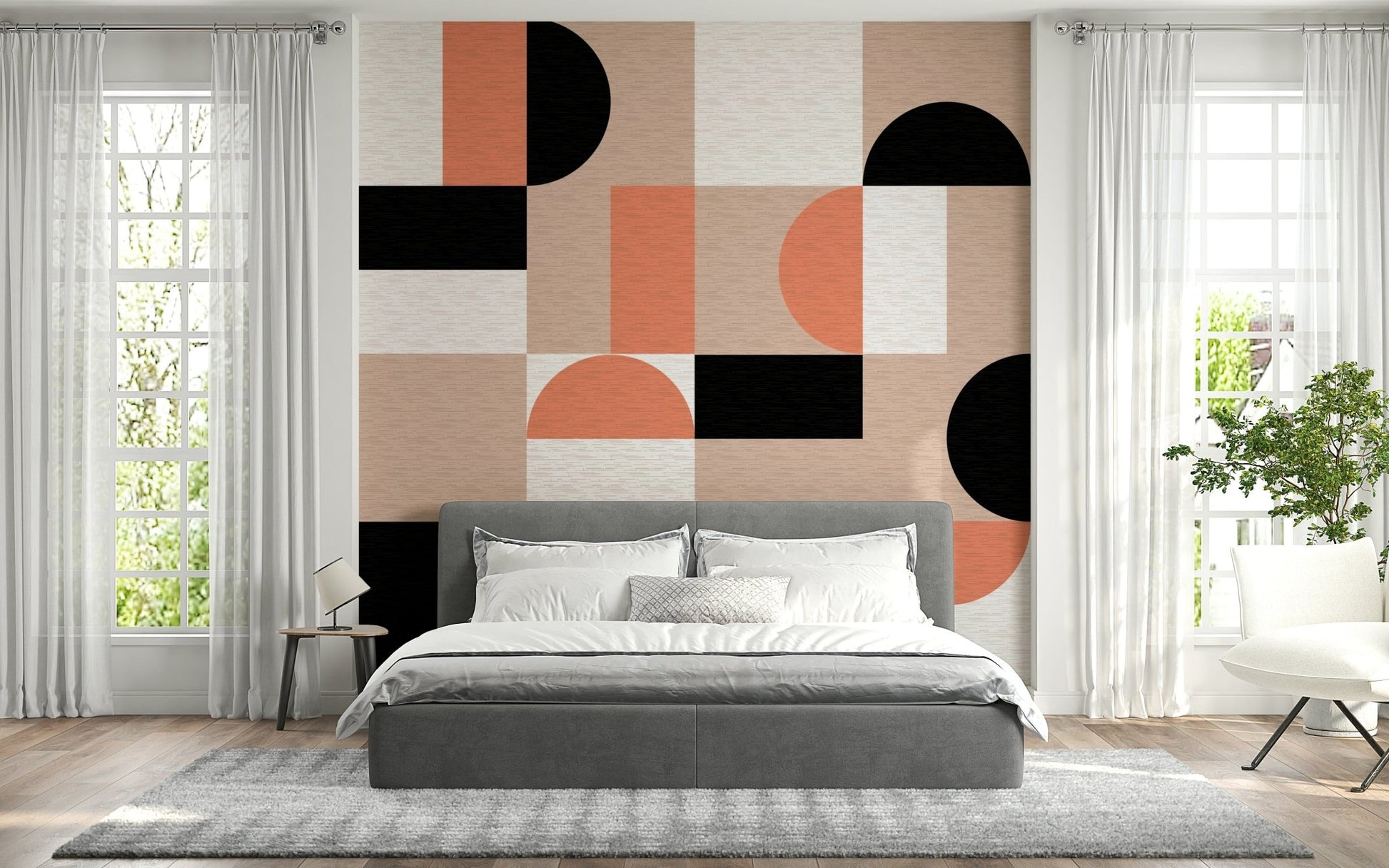 Blush Geometry wallpaper mural behind a grey upholstered bed flanked by tall sheer-curtained windows