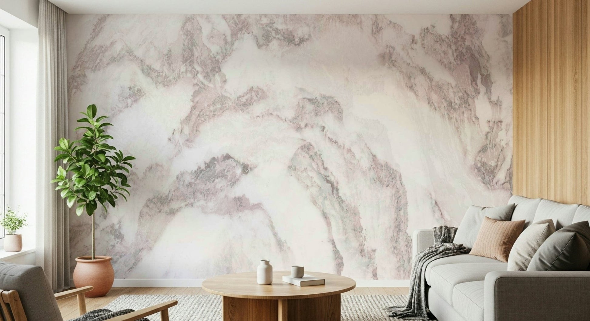Blush Stone Texture wallpaper mural in soft pink marble behind a grey sofa and light wood armchair with a globe lamp