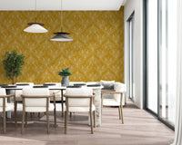Boho Art Nouveau Folk Floral Mustard Gold wallpaper behind a long dining table with cream chairs by tall windows