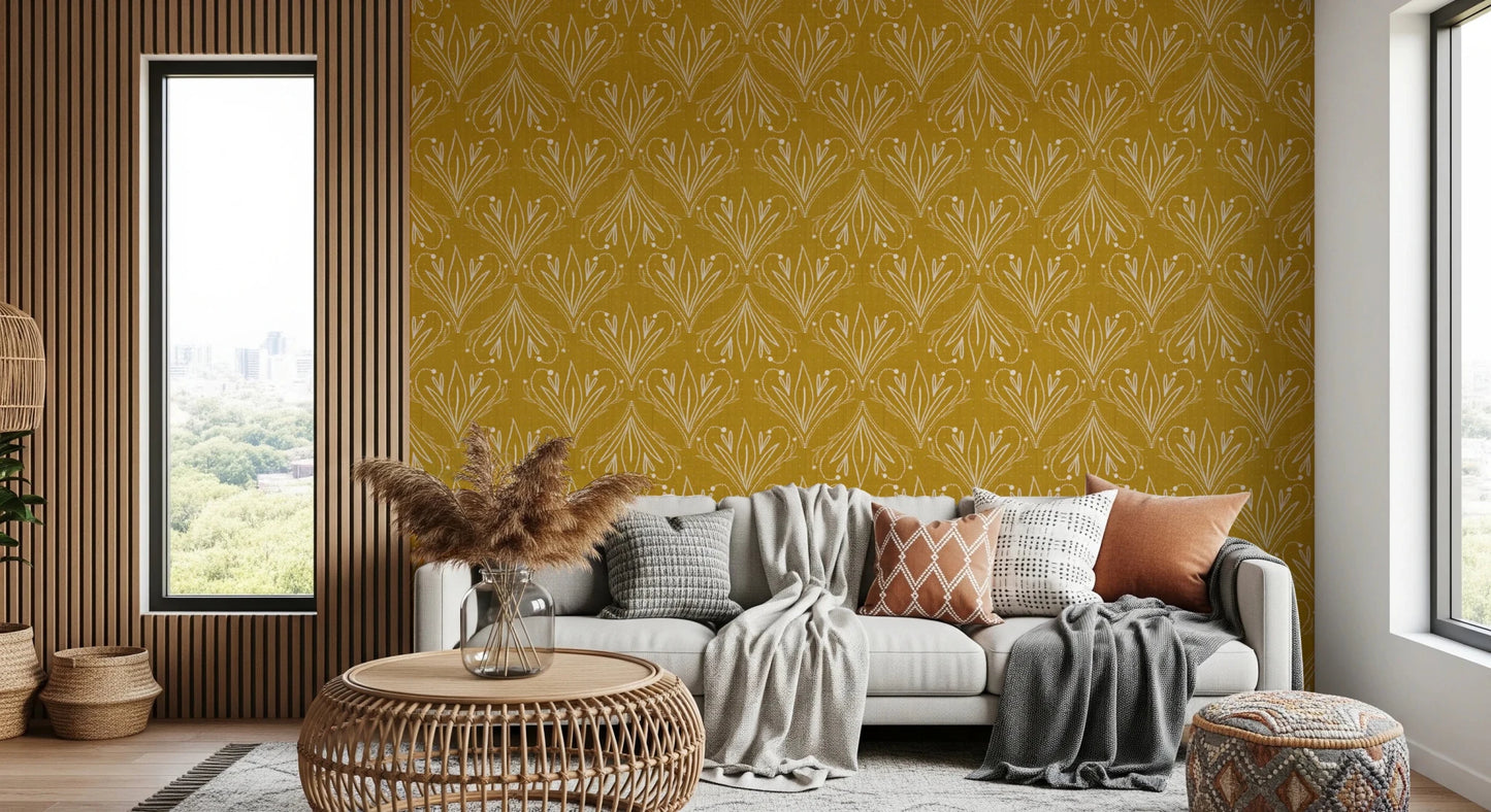 Boho Art Nouveau Folk Floral Mustard Gold wallpaper behind a white sofa with pampas grass in a boho living room