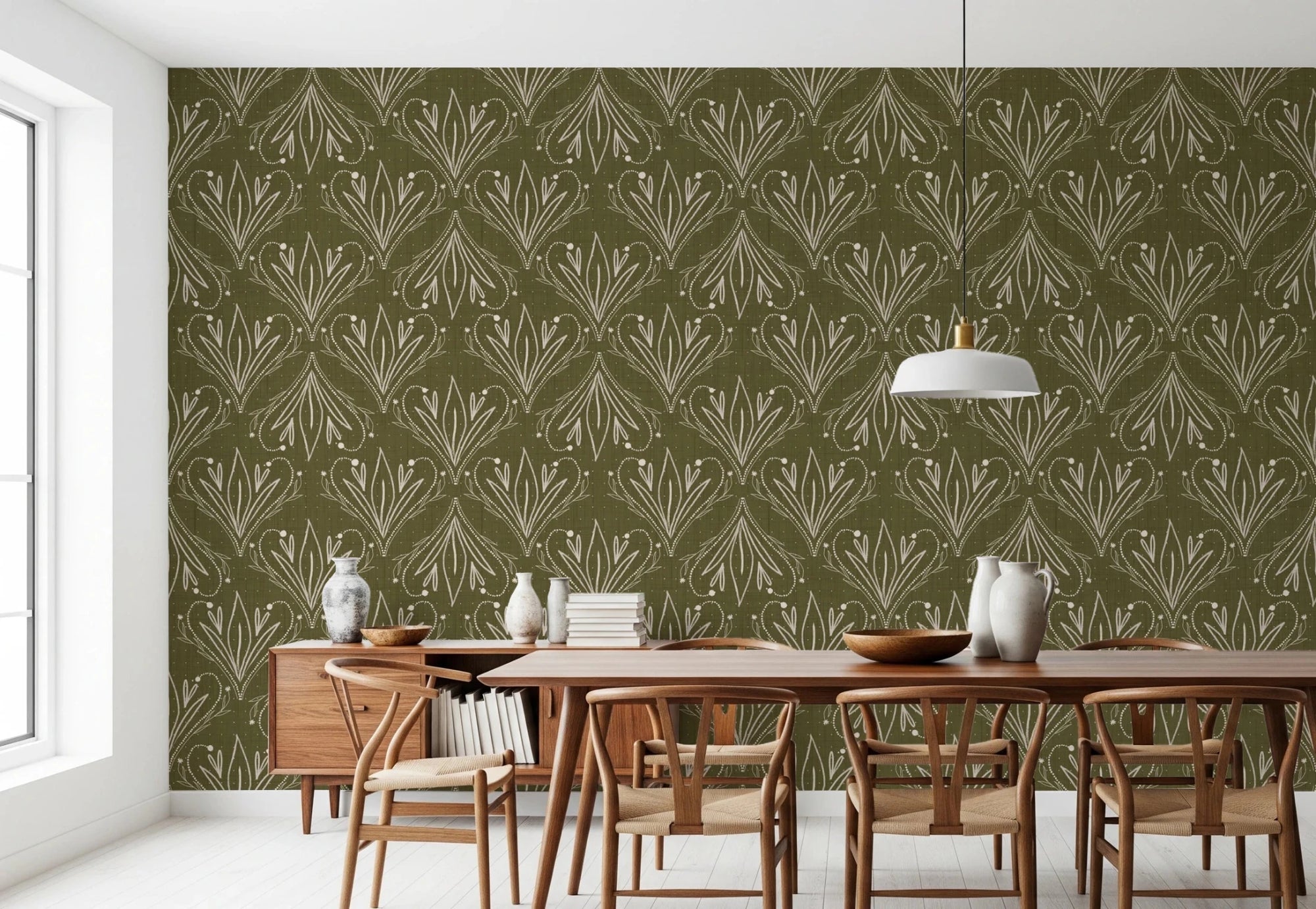 Boho Art Nouveau Folk Floral Olive Green wallpaper behind a wood dining table and wishbone chairs in a dining room