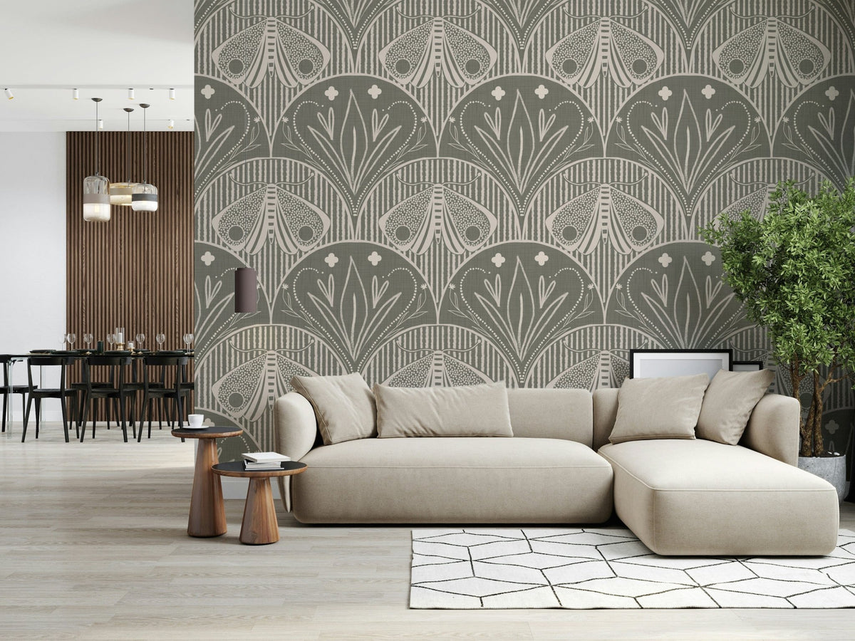 Boho Art Nouveau Scallop Butterfly Floral in Warm Taupe Grey wallpaper behind a beige sectional sofa in a living room